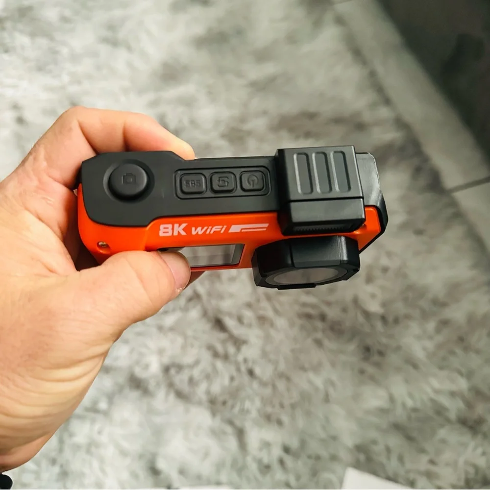 Orange and Black Simulated Camera with Rugged Design
